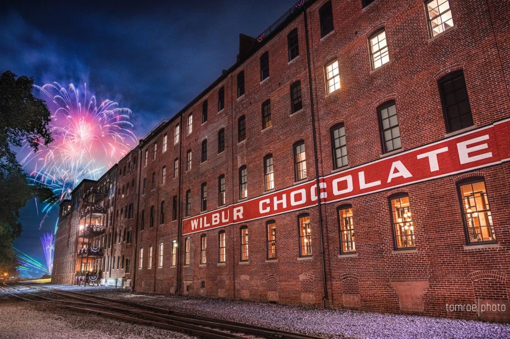 Wilbur Chocolate Factory with Fourth of July fireworks in background